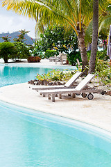 Image showing deck chairs by the pool