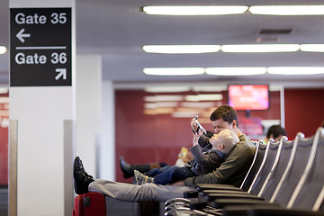 Image showing father and son at the airport