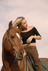 Image showing blond riding girl