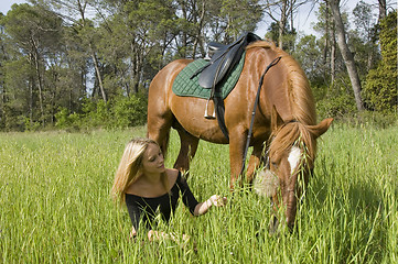 Image showing blond girl and her stallion
