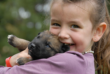 Image showing little girl and puppy