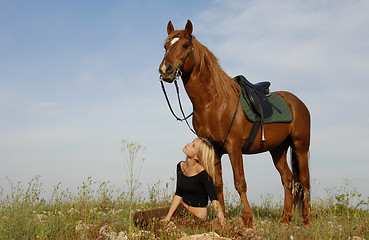 Image showing teen and horse in field