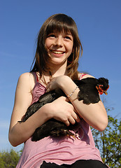 Image showing happy girl and chicken