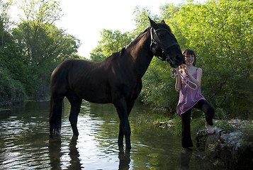 Image showing child and horse in river