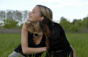 Image showing happy young teenager and her dog