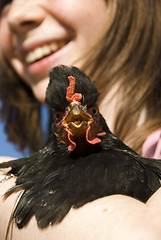 Image showing child and her chicken