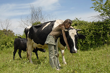 Image showing teen and cow