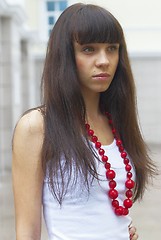 Image showing Girl with red beads