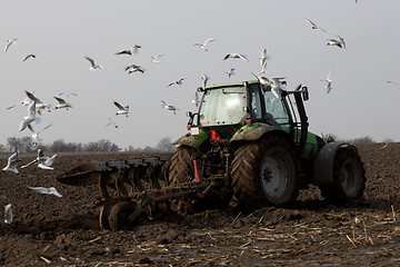 Image showing Farmer plowing