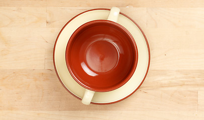 Image showing Cup of soup on a plate