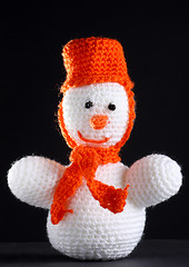 Image showing White snowman at the dark background