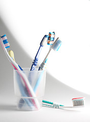 Image showing Toothbrushes in a glass