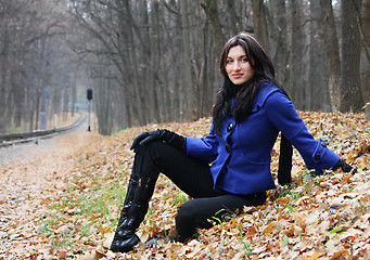 Image showing Young woman in the autumn park