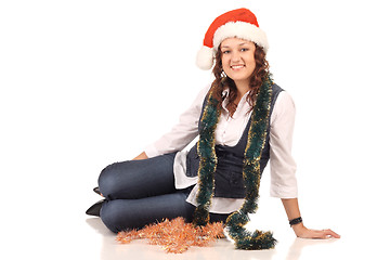 Image showing Girl in a santa hat with christmas decoration