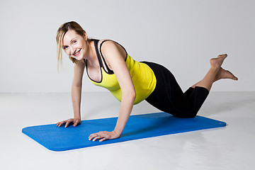 Image showing Pregnant woman doing push-up exercise