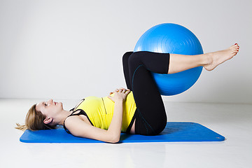 Image showing Pregnant woman exercising with fitness ball
