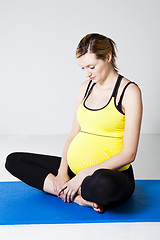 Image showing Pregnant woman stretching