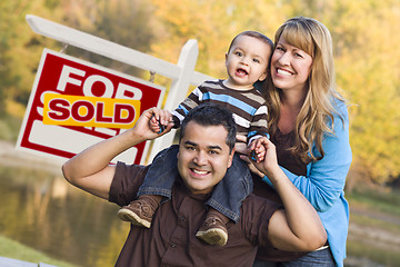 Image showing Mixed Race Couple, Baby, Sold Real Estate Sign