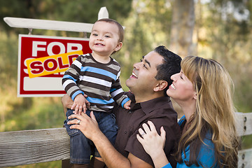 Image showing Mixed Race Couple, Baby, Sold Real Estate Sign