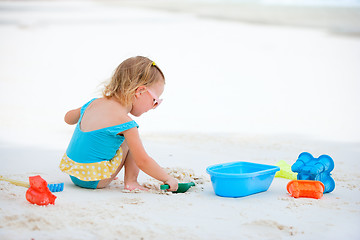 Image showing Little girl playing at beach