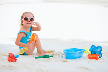 Image showing Little girl playing at beach