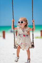 Image showing Little girl swinging