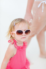 Image showing Toddler girl and mother at beach