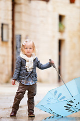 Image showing Little girl on rainy day