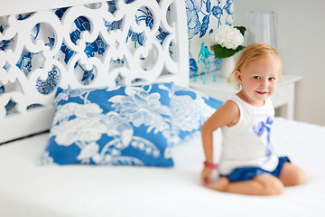 Image showing Adorable smiling toddler girl in bedroom