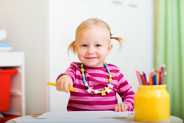 Image showing Playful little girl drawing 