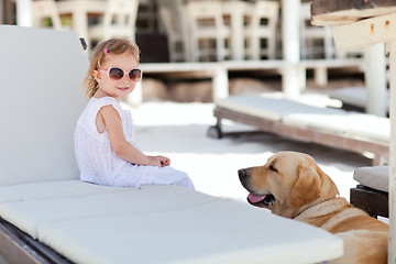 Image showing Little girl and dog