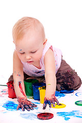 Image showing Toddler girl painting