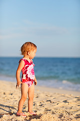 Image showing Toddler girl on beach at sunset