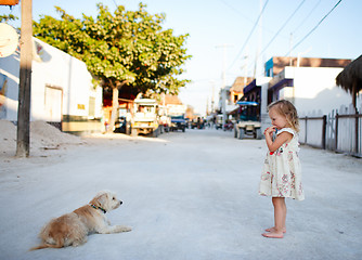 Image showing Girl and dog at town