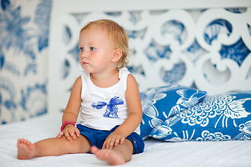 Image showing Adorable thoughtful toddler girl in bedroom