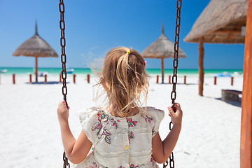 Image showing Little girl swinging