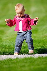 Image showing Baby girl walking