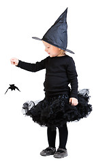 Image showing Little witch holding small bat