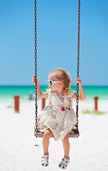 Image showing Little girl swinging