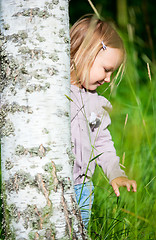 Image showing Little girl outdoors at summer day