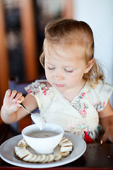 Image showing Girl eating breakfast