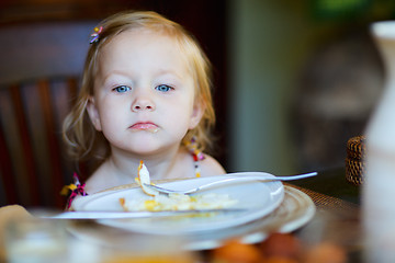 Image showing Toddler girl having breakfast