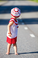 Image showing Playful toddler girl on road