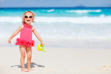 Image showing Little girl playing at beach