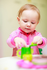 Image showing Little girl playing with toys