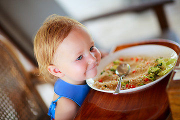 Image showing Toddler girl eating lunch