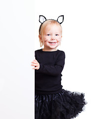 Image showing Girl in black cat costume with banner