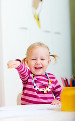 Image showing Happy girl with coloring pencils