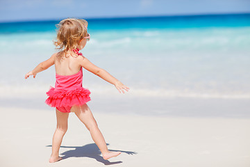 Image showing Little girl on tropical beach