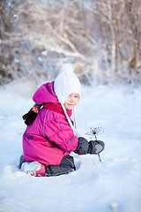 Image showing Little girl outdoors on winter day